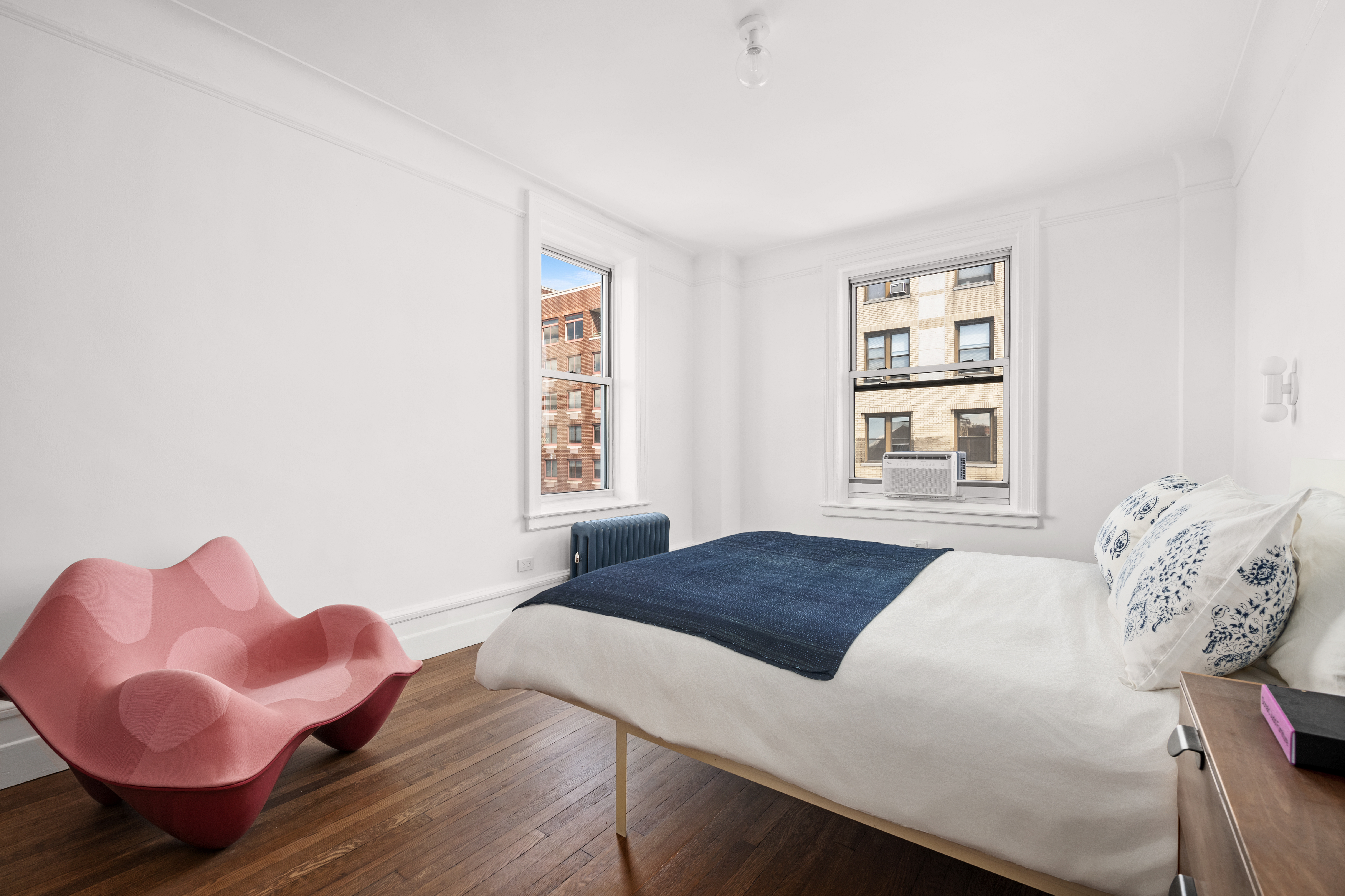 600 West 115th Street, Unit 1004 Manhattan, NY 10025 - Photo 7 of 13 a bedroom with a bed and window
