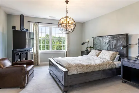 a bathroom with a double vanity sink mirror and shower