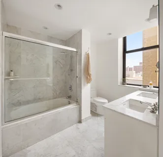 a kitchen with stainless steel appliances granite countertop a sink and a refrigerator
