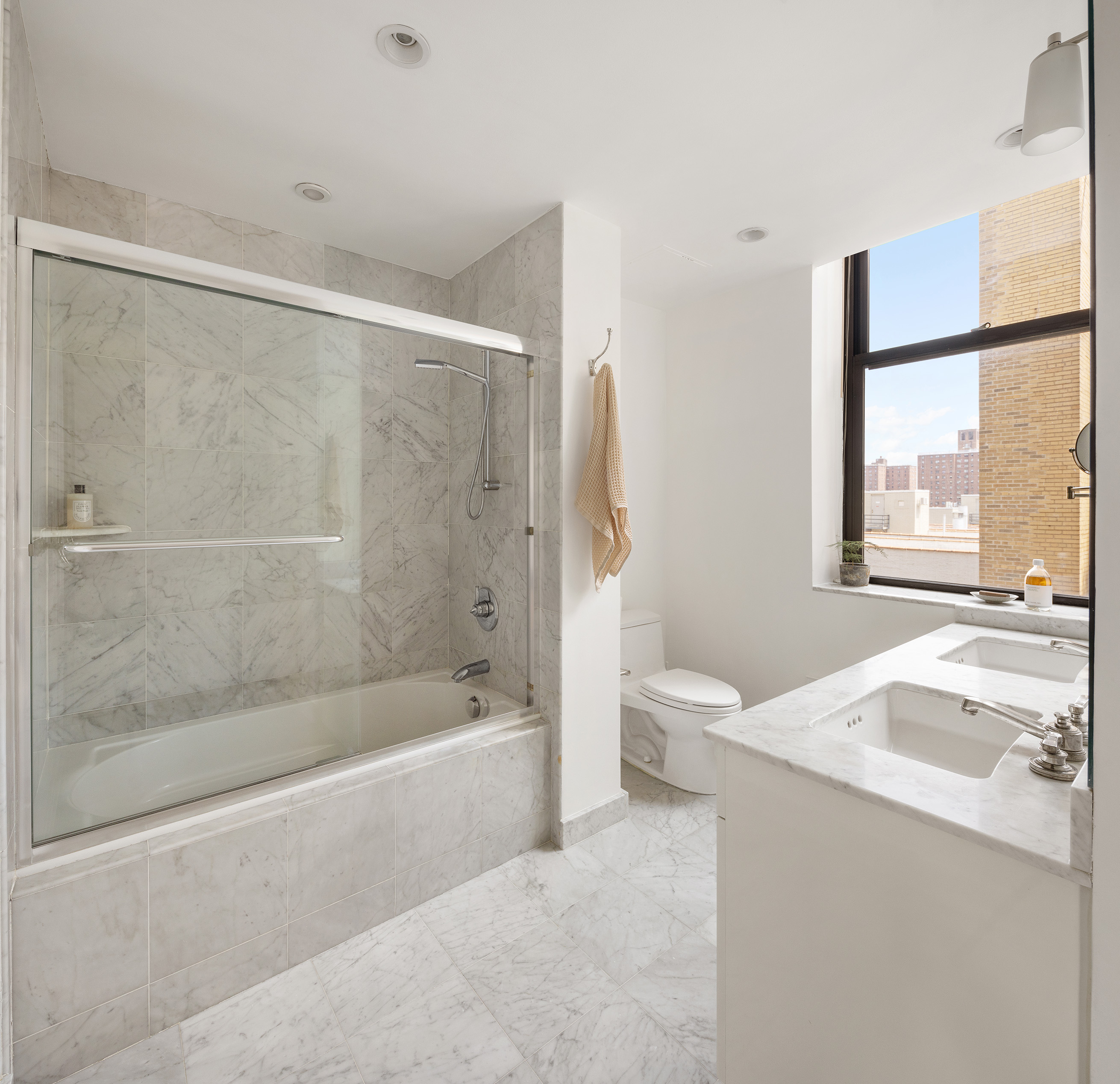 1255 5th Avenue, Unit 6D Manhattan, NY 10029 - Photo 5 of 13 a bath room with a bath tub and a shower