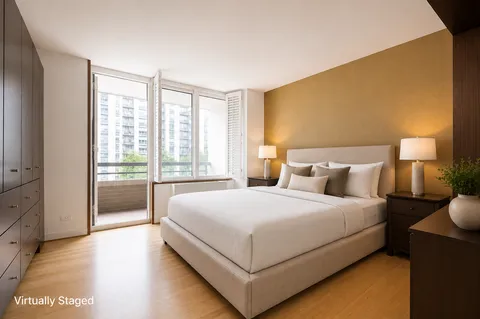 a bedroom with a bed and a night stand