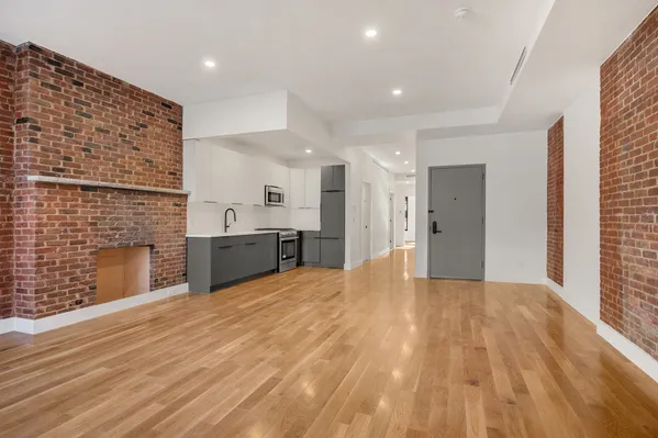 a view of kitchen with granite countertop cabinets and outdoor space