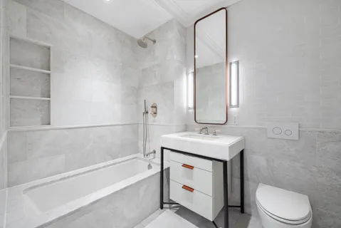 a bathroom with a sink toilet and vanity