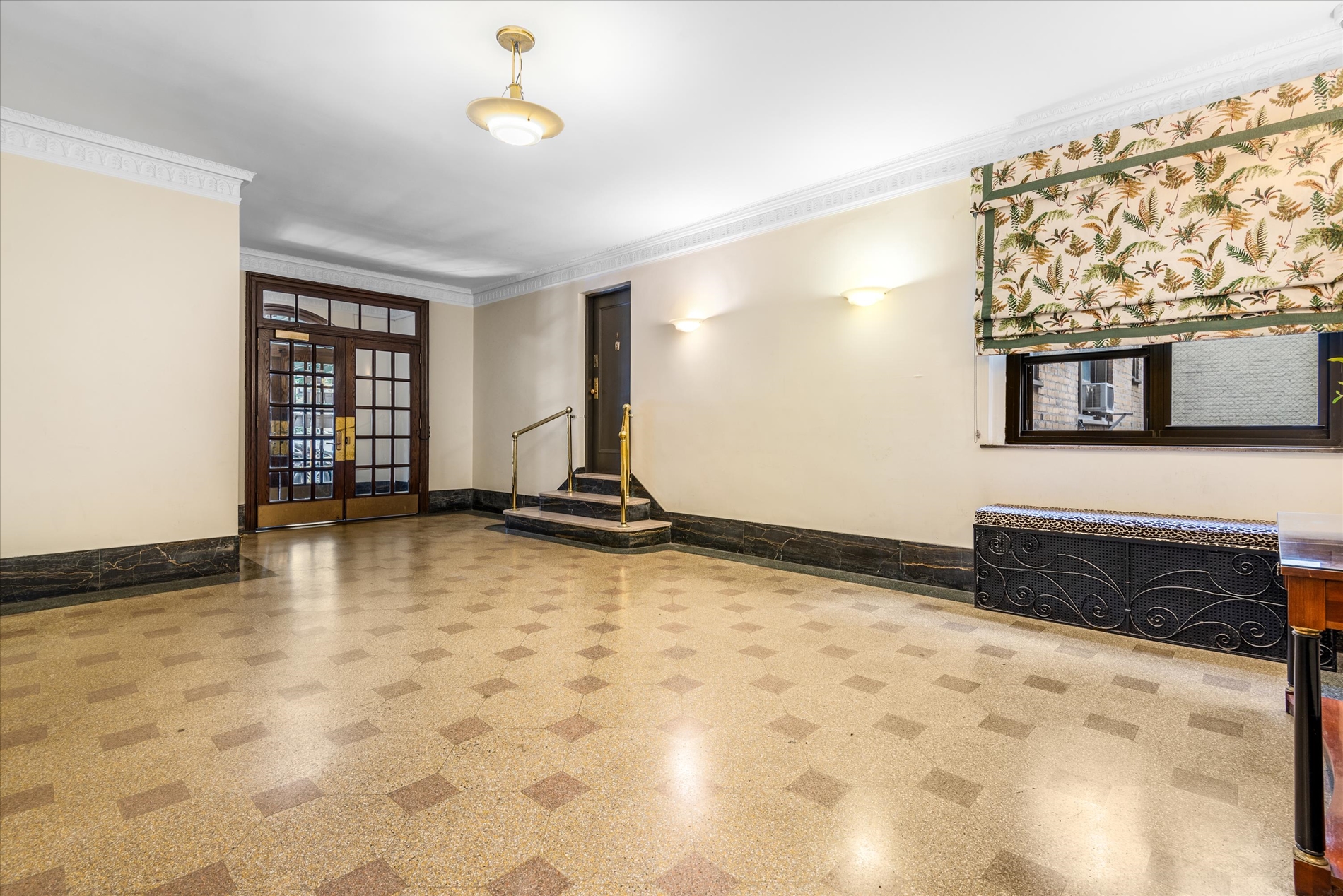 345 East 77th Street, Unit 3C Manhattan, NY 10075 - Photo 15 of 19 a view of a livingroom with wooden floor and a window
