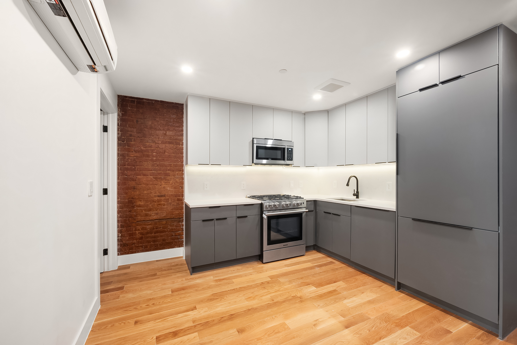 61 West 70th Street, Unit 1A Manhattan, NY 10023 - Photo 3 of 15 a large kitchen with cabinets