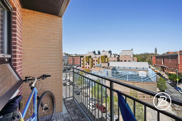 a view of a balcony with furniture