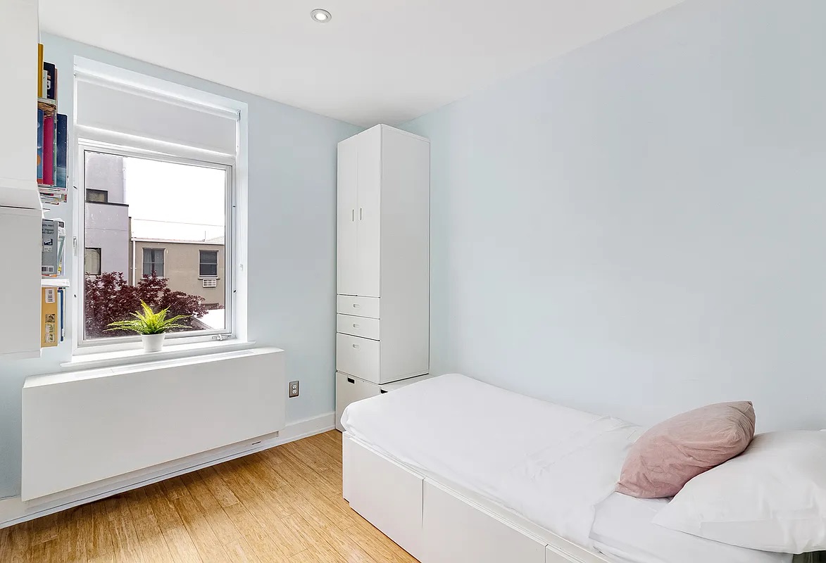 12 Monitor Street, Unit 3B Brooklyn, NY 11222 - Photo 7 of 11 a bedroom with a bed and a window