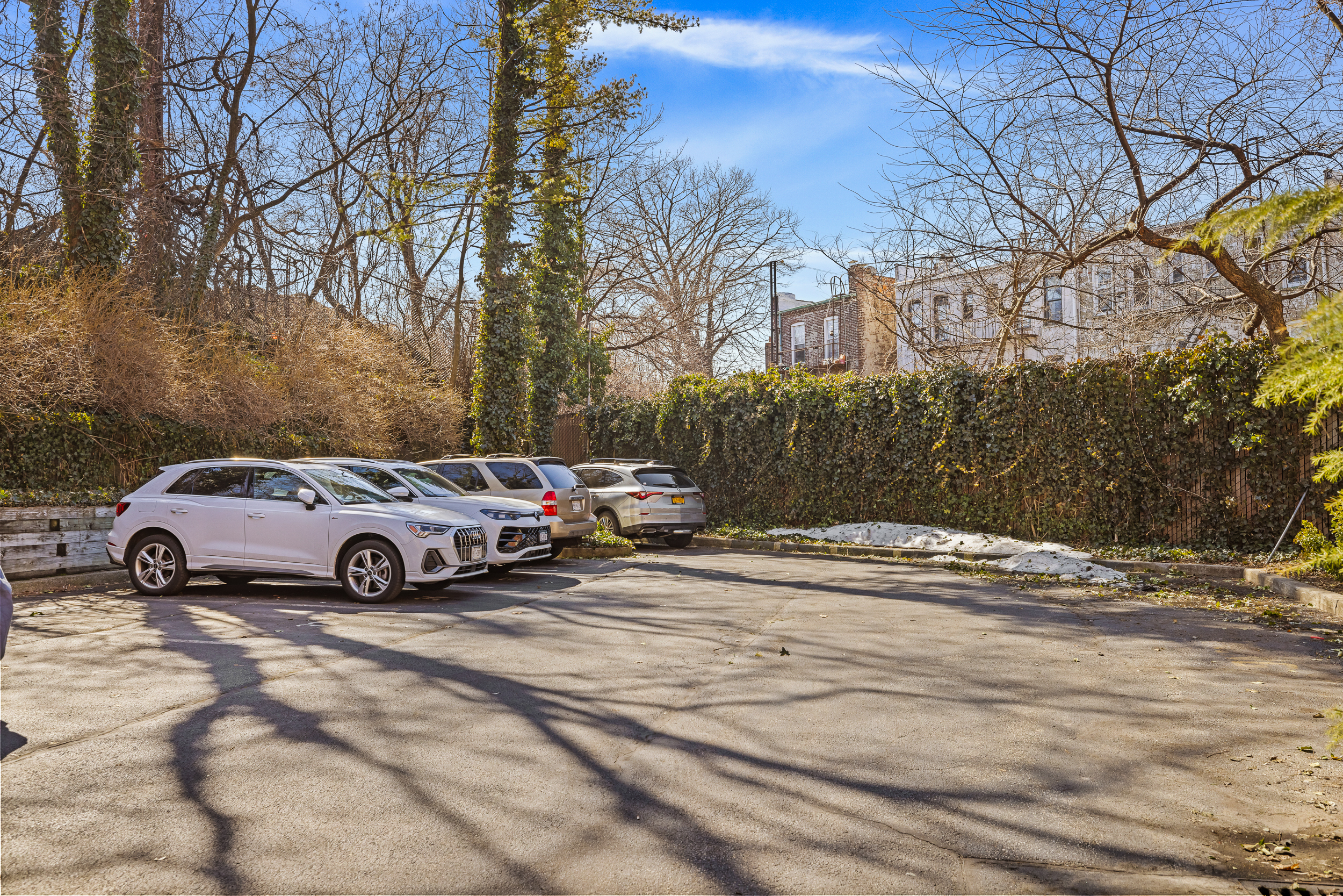 61-20 71st Avenue, Unit J1B Queens, NY 11385 - Photo 11 of 13 a view of street with parked cars