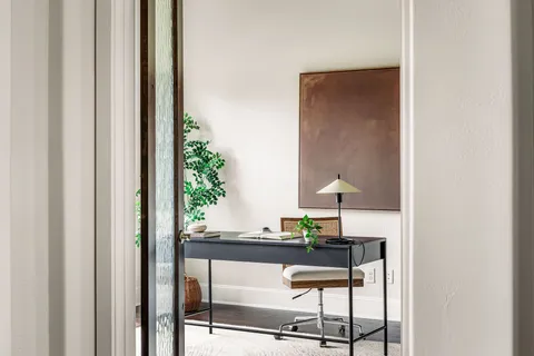 a kitchen with stainless steel appliances granite countertop a sink and a window