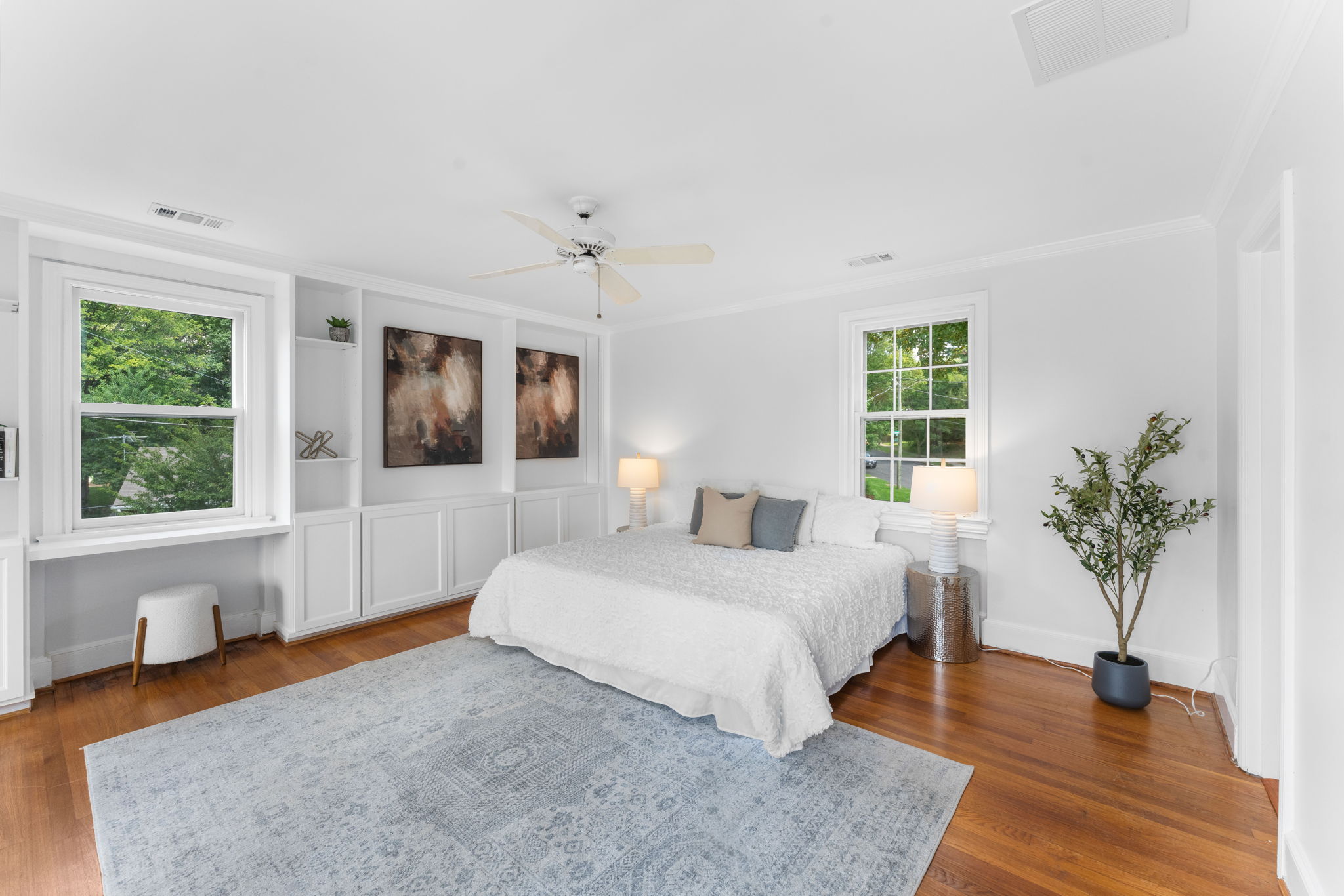 1325 Locust Road Northwest Washington, DC 20012 - Photo 25 of 56 a spacious bedroom with a large bed and a wooden floor