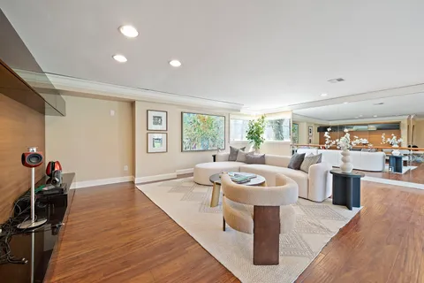 a front view of a house with a yard table and chairs