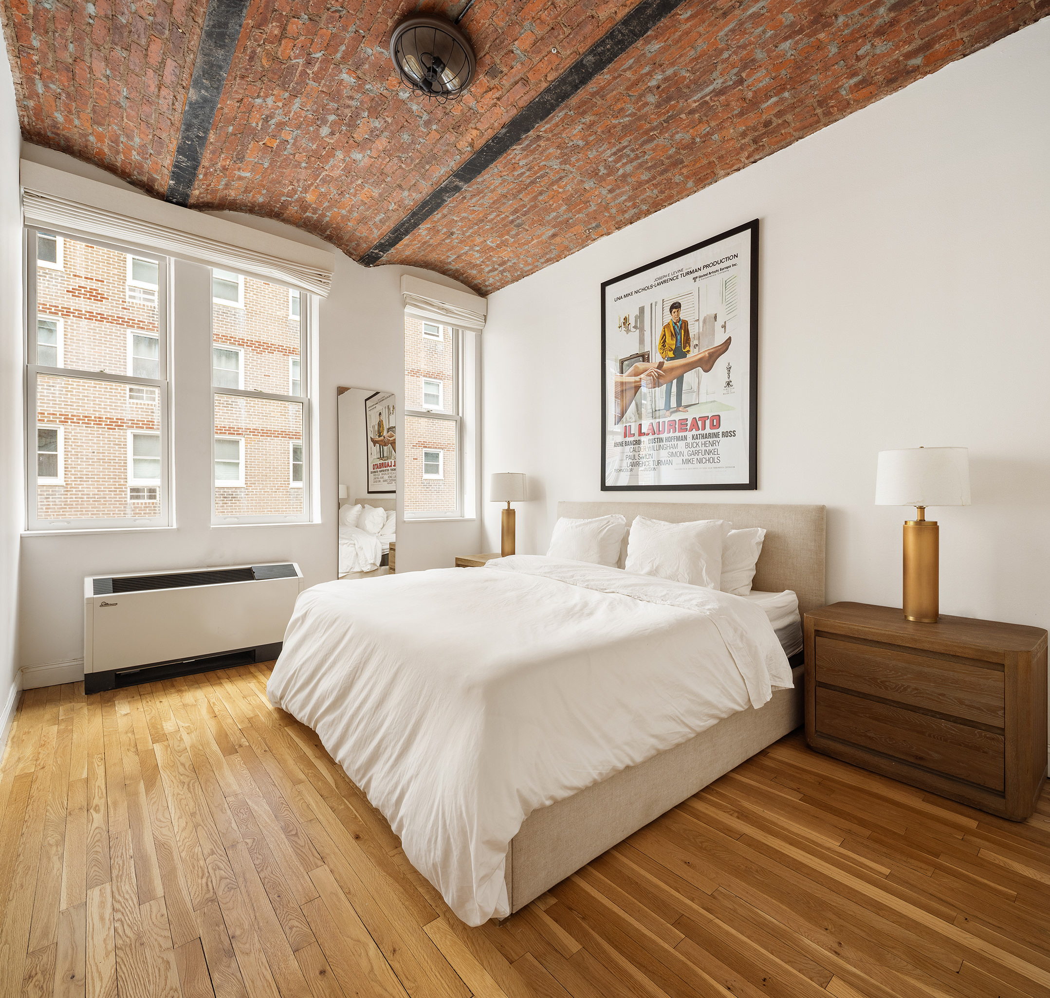 9 Barrow Street, Unit 6D Manhattan, NY 10014 - Photo 4 of 9 a spacious bedroom with a bed and a large window