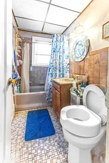 a view of a house with a door and wooden walls