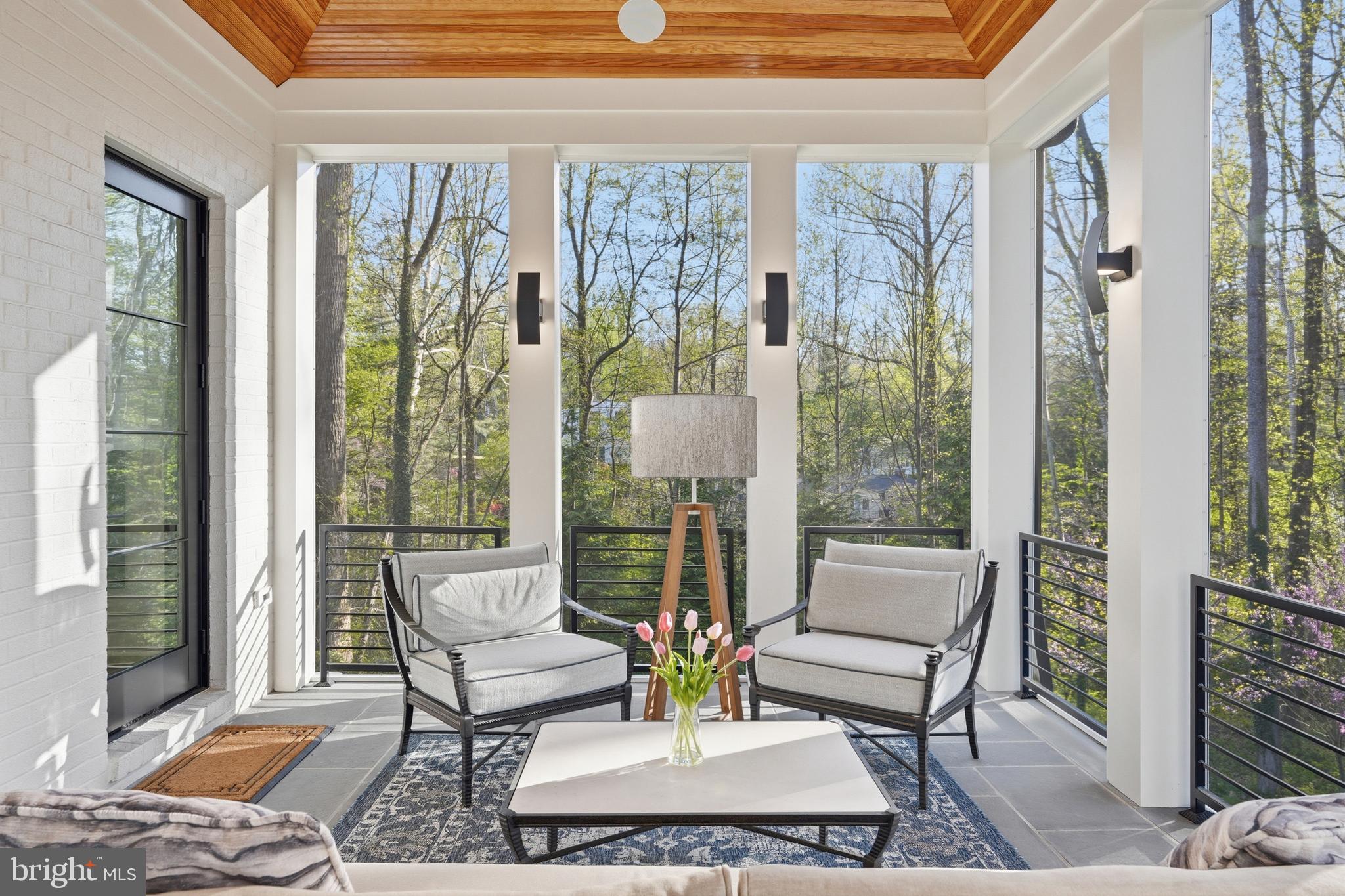 938 Saigon Road McLean, VA 22102 - Photo 38 of 107 a living room with furniture and a floor to ceiling window