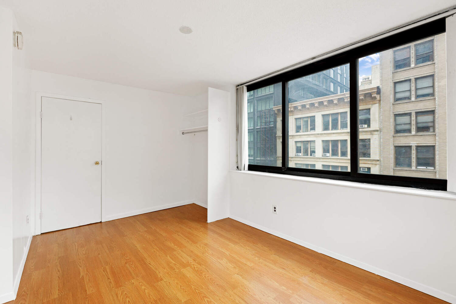 376 Broadway, Unit 6F Manhattan, NY 10013 - Photo 10 of 17 a view of an empty room with a window