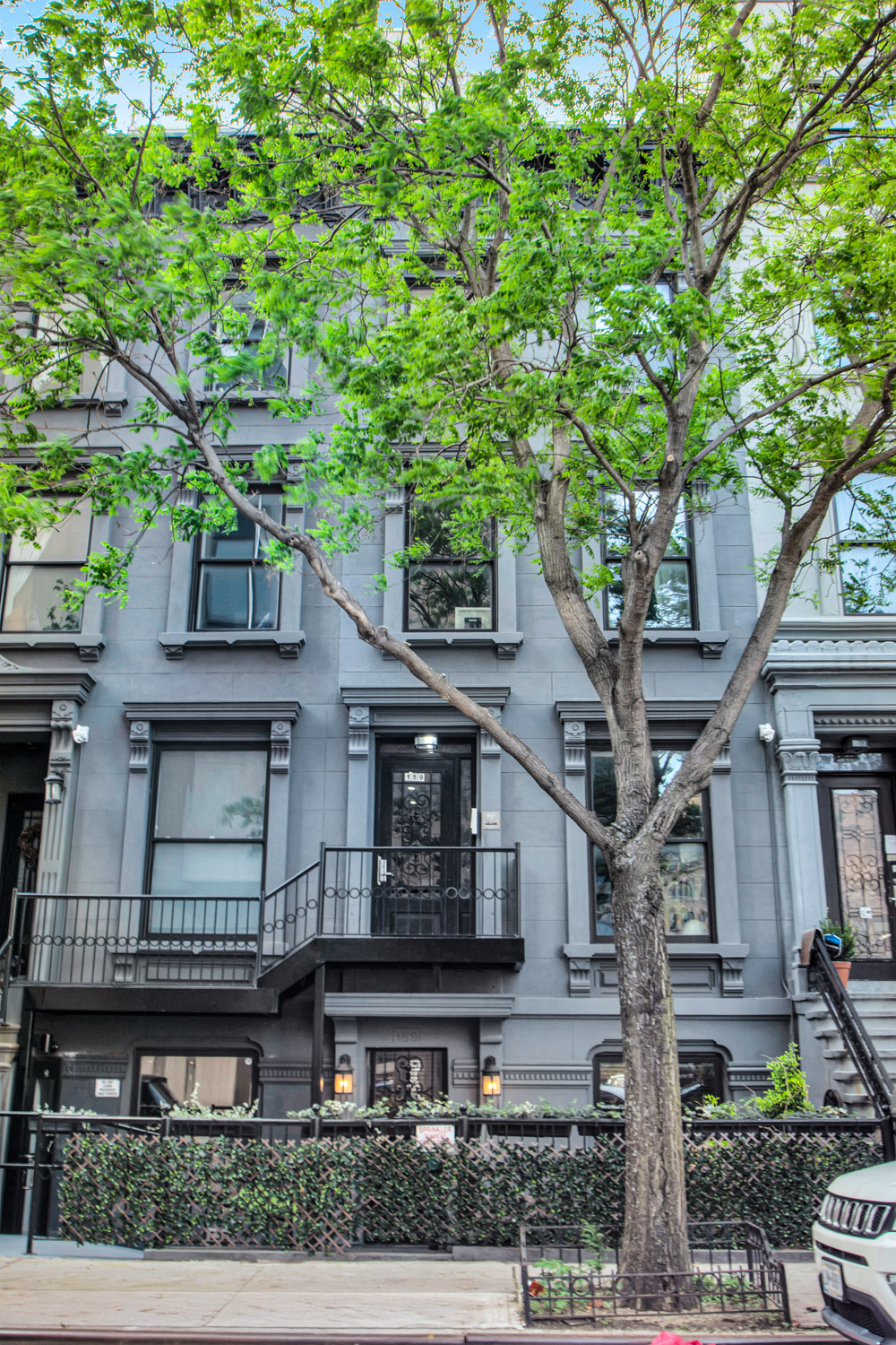 159 West 126th Street, Unit GARDEN A Manhattan, NY 10027 - Photo 12 of 15 front view of a house with a tree