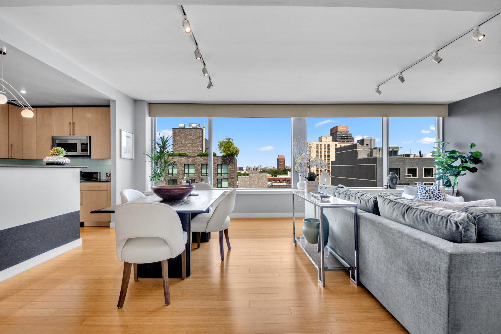 40 West 116th Street, Unit PHA1208 Manhattan, NY 10026 - Photo 3 of 28 a living room with fireplace furniture and a wooden floor