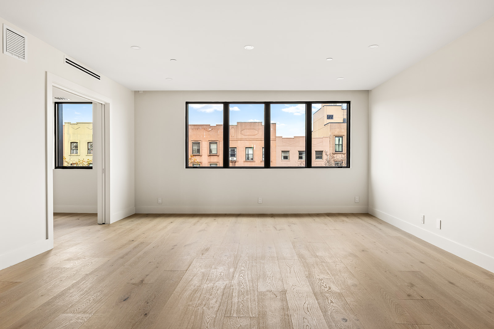 78 1st Place, Unit 5 Brooklyn, NY 11231 - Photo 2 of 24 wooden floor in an empty room with a window