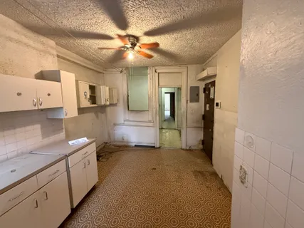 a view of a kitchen with a sink and dishwasher