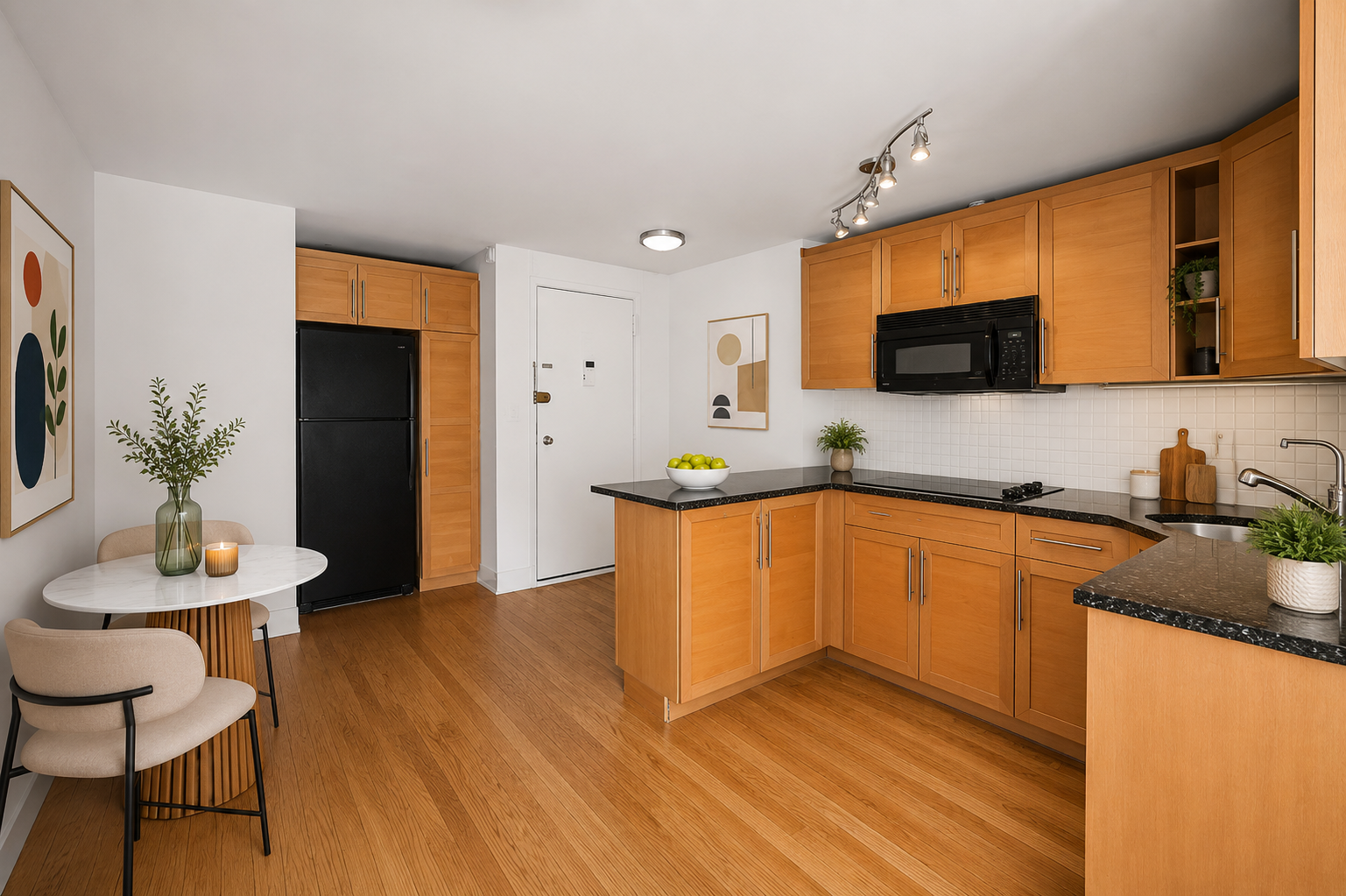 435 East 86th Street, Unit 4E Manhattan, NY 10028 - Photo 3 of 9 a kitchen with stainless steel appliances granite countertop a sink a stove a microwave a dining table and chairs with wooden floor