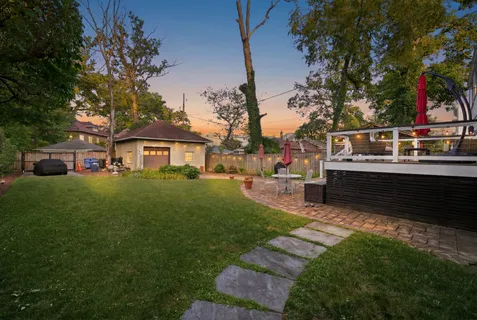 a view of a house with a yard porch and sitting area