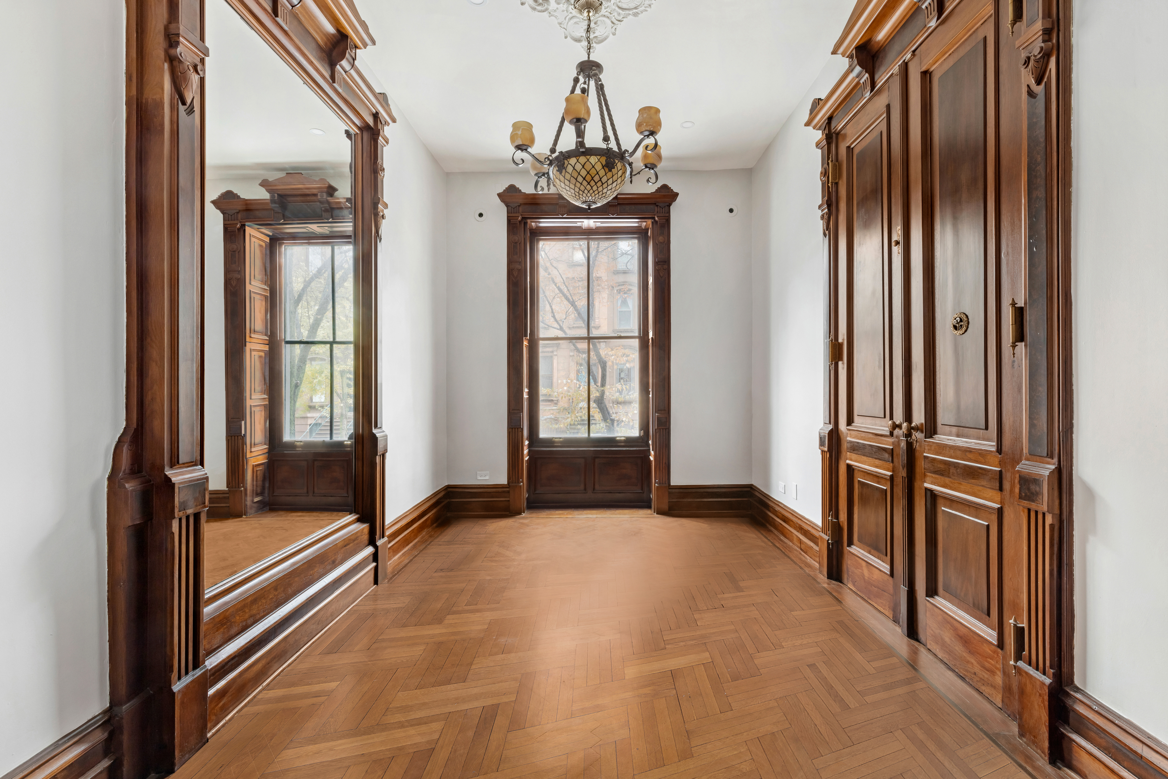 29 East 126th Street, Unit A Manhattan, NY 10035 - Photo 5 of 13 a view of a hallway with windows