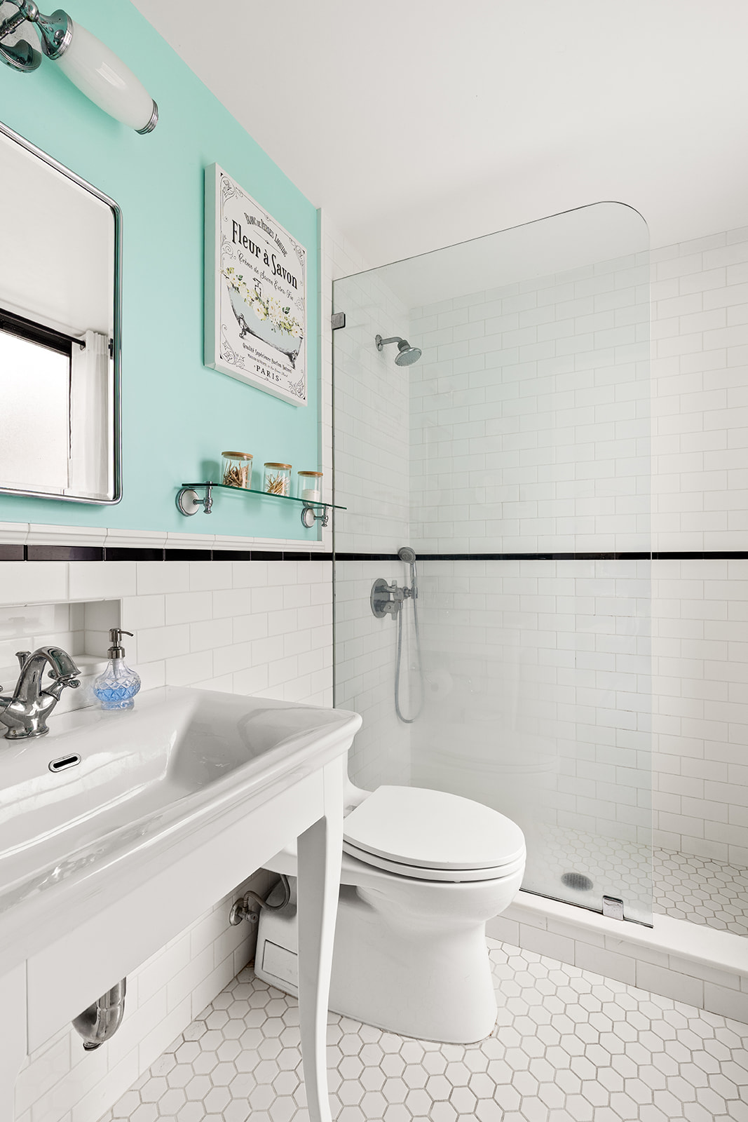 41 West 72nd Street, Unit 10B Manhattan, NY 10023 - Photo 5 of 7 a bathroom with a toilet a sink and mirror