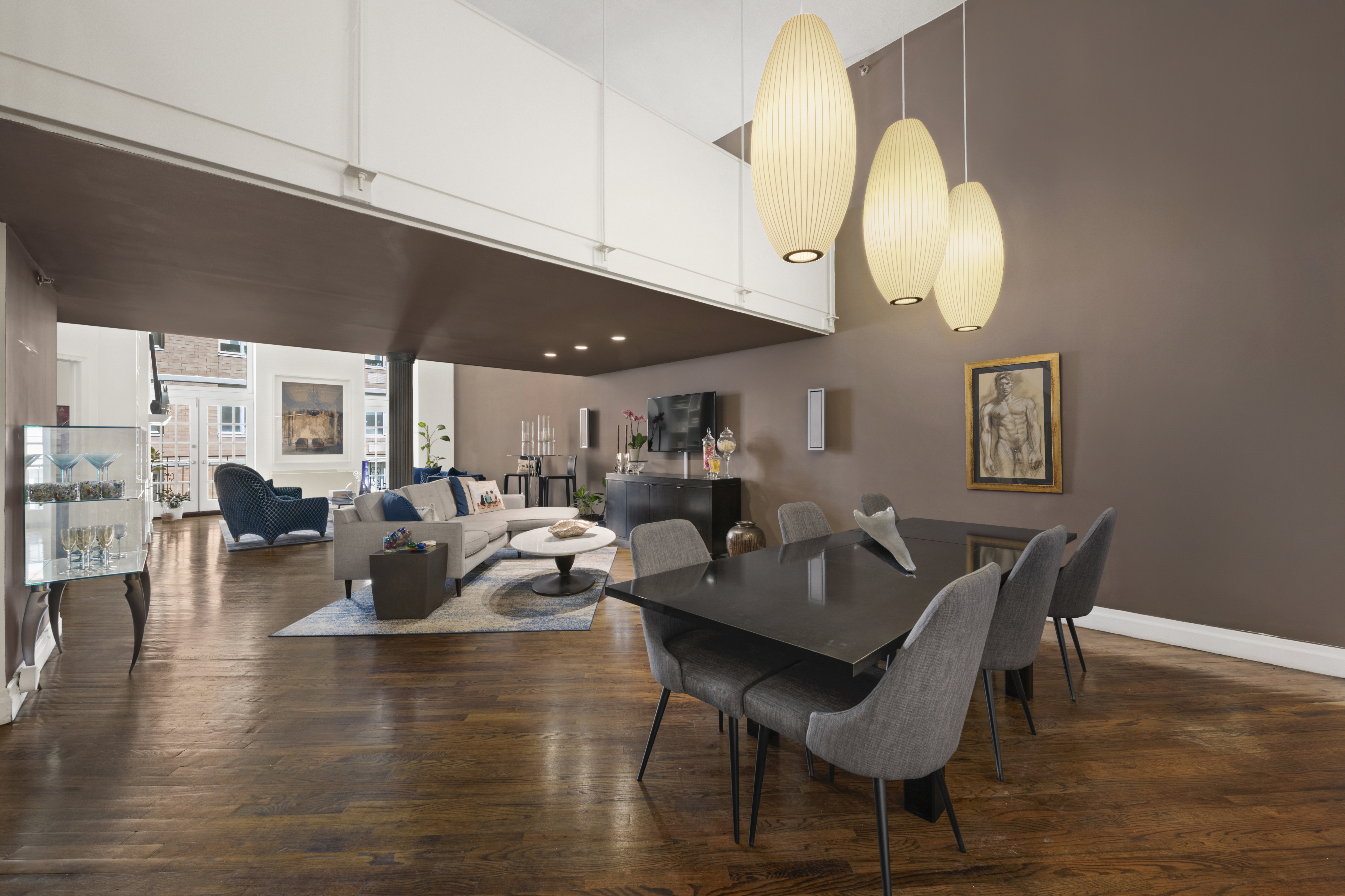 121 West 20th Street, Unit 2D Manhattan, NY 10011 - Photo 4 of 12 a living room with fireplace furniture and a wooden floor
