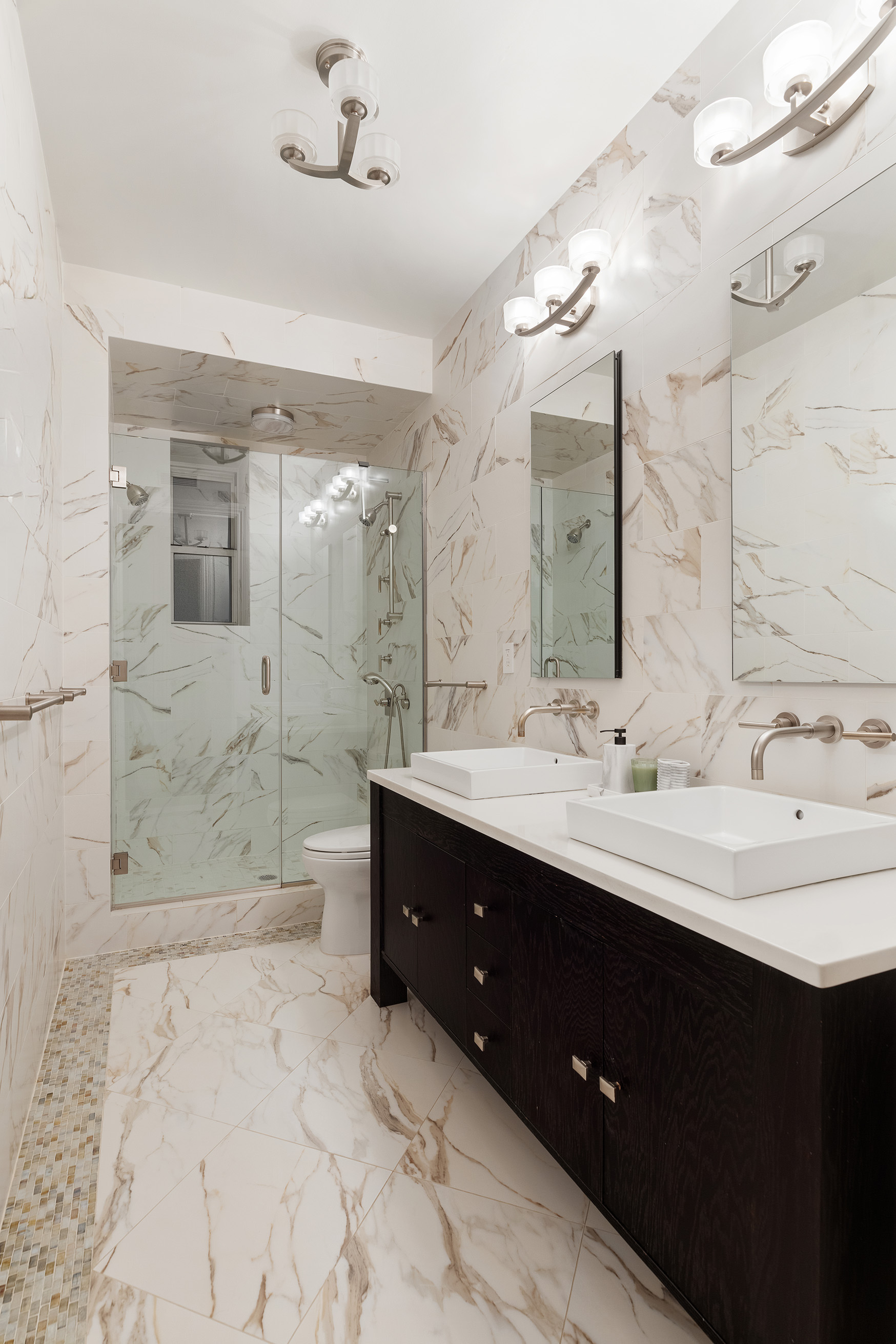 137 Riverside Drive, Unit 2D Manhattan, NY 10024 - Photo 5 of 20 a bathroom with a sink shower and a mirror