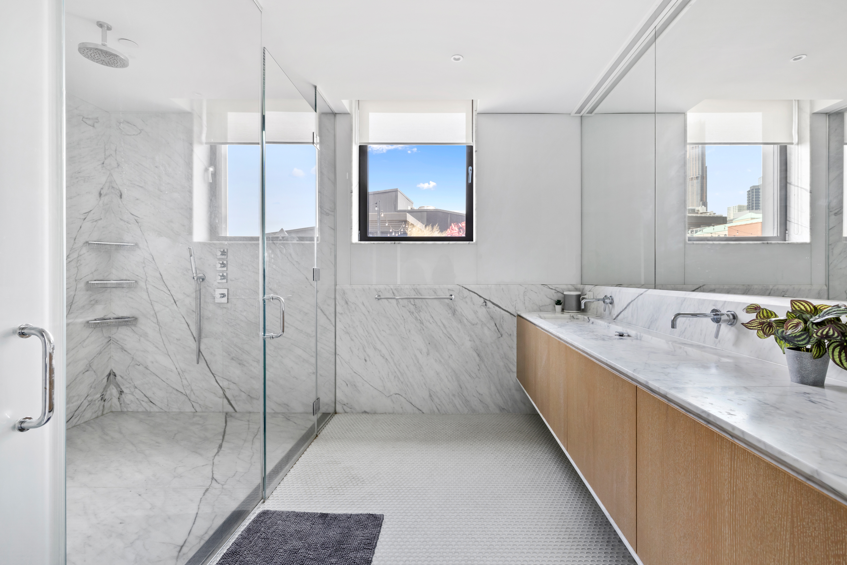 210 Pacific Street, Unit 6 Brooklyn, NY 11201 - Photo 11 of 20 a bathroom with a double vanity sink mirror and shower