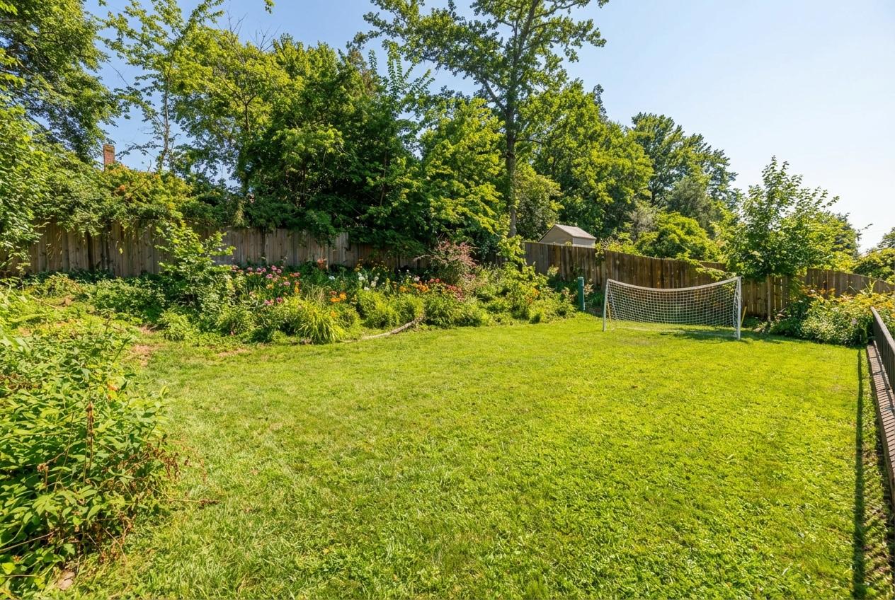 6027 Walhonding Road Bethesda, MD 20816 - Photo 4 of 9 a view of an outdoor space and a yard