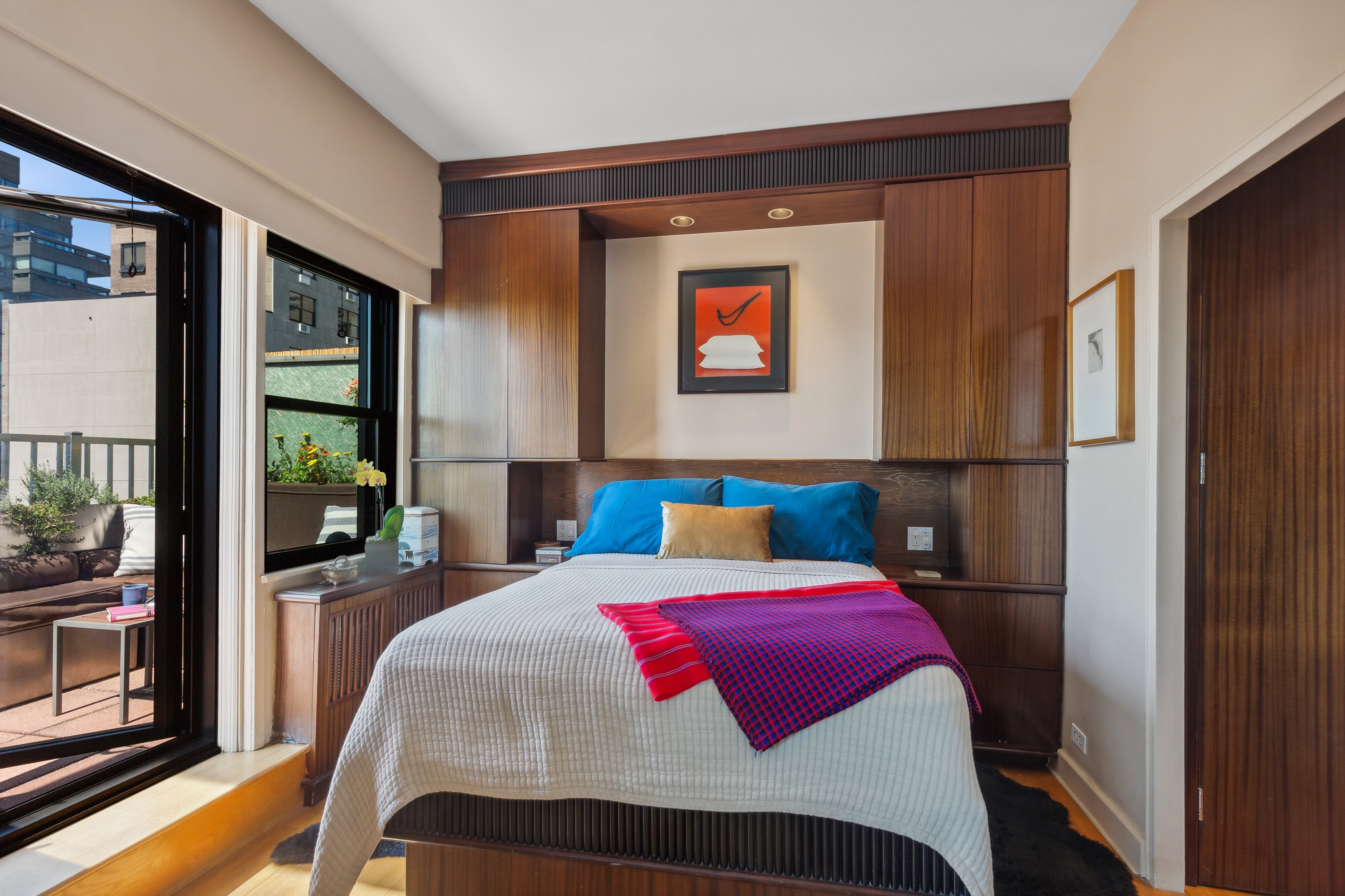 210 East 15th Street, Unit PHD Manhattan, NY 10003 - Photo 7 of 12 a bedroom with a bed and a window