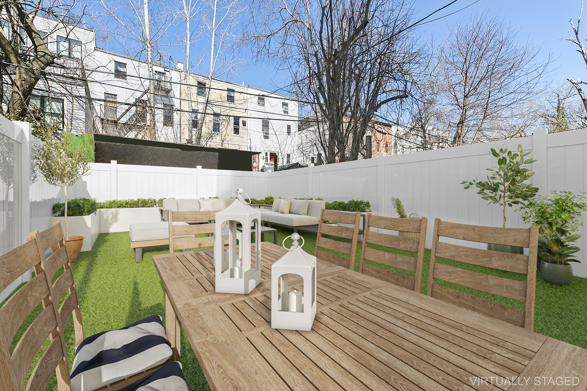 647 Dekalb Avenue, Unit 1B Brooklyn, NY 11216 - Photo 2 of 9 a roof deck with table and chairs and wooden floor