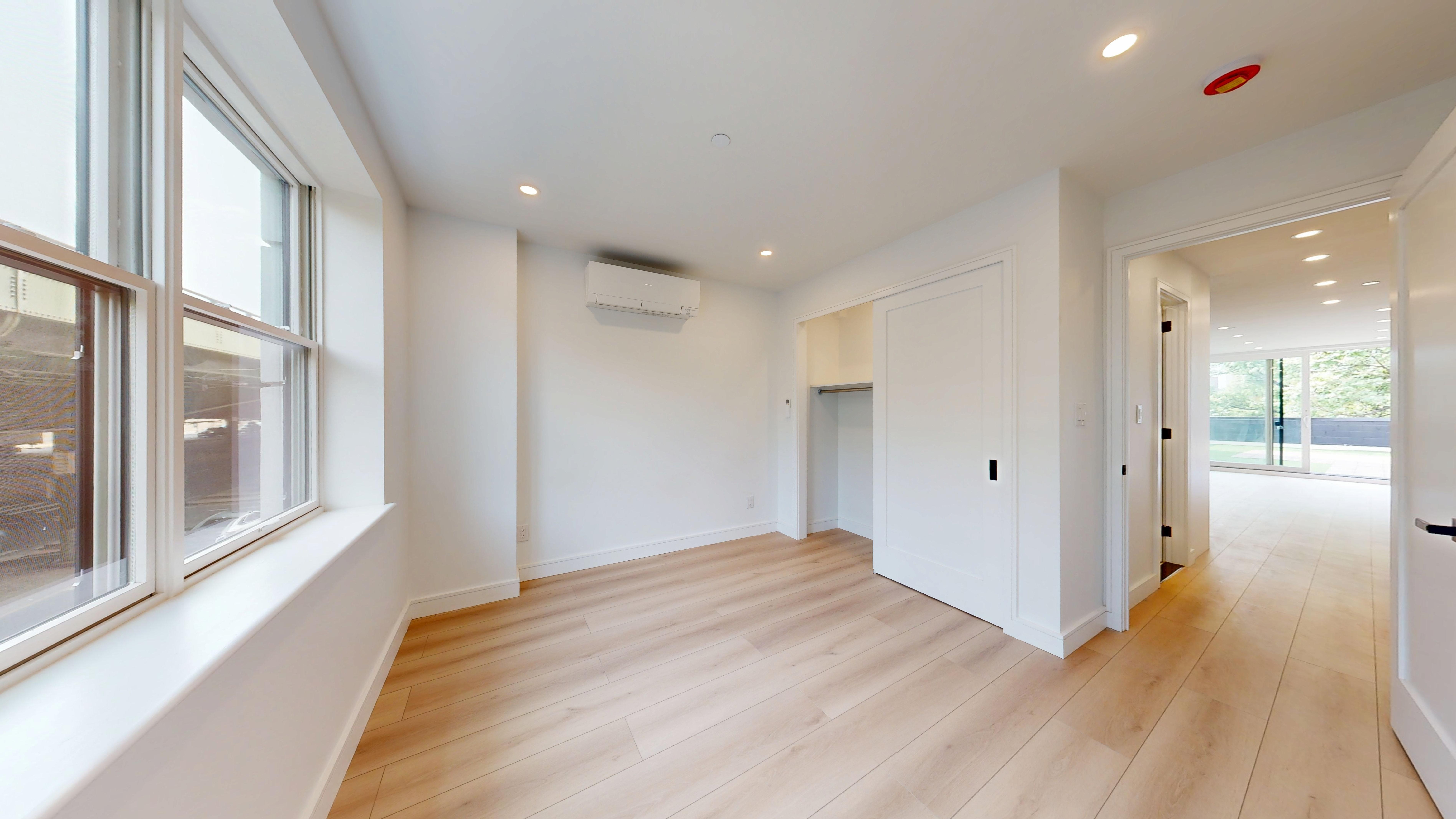 5614 3rd Avenue, Unit 2 Brooklyn, NY 11220 - Photo 12 of 12 a view of hallway with wooden floor