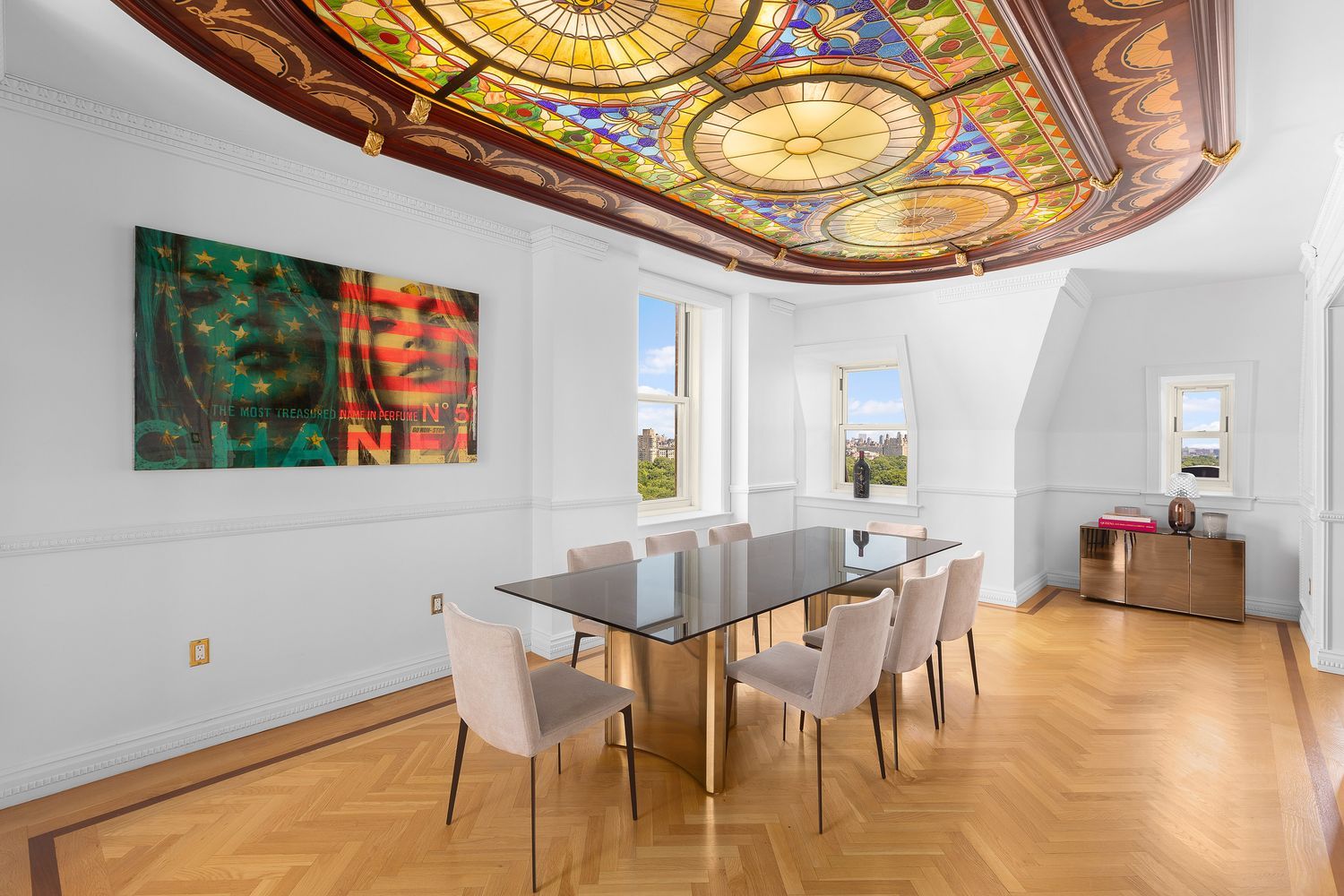 a dining room with furniture and wooden floor