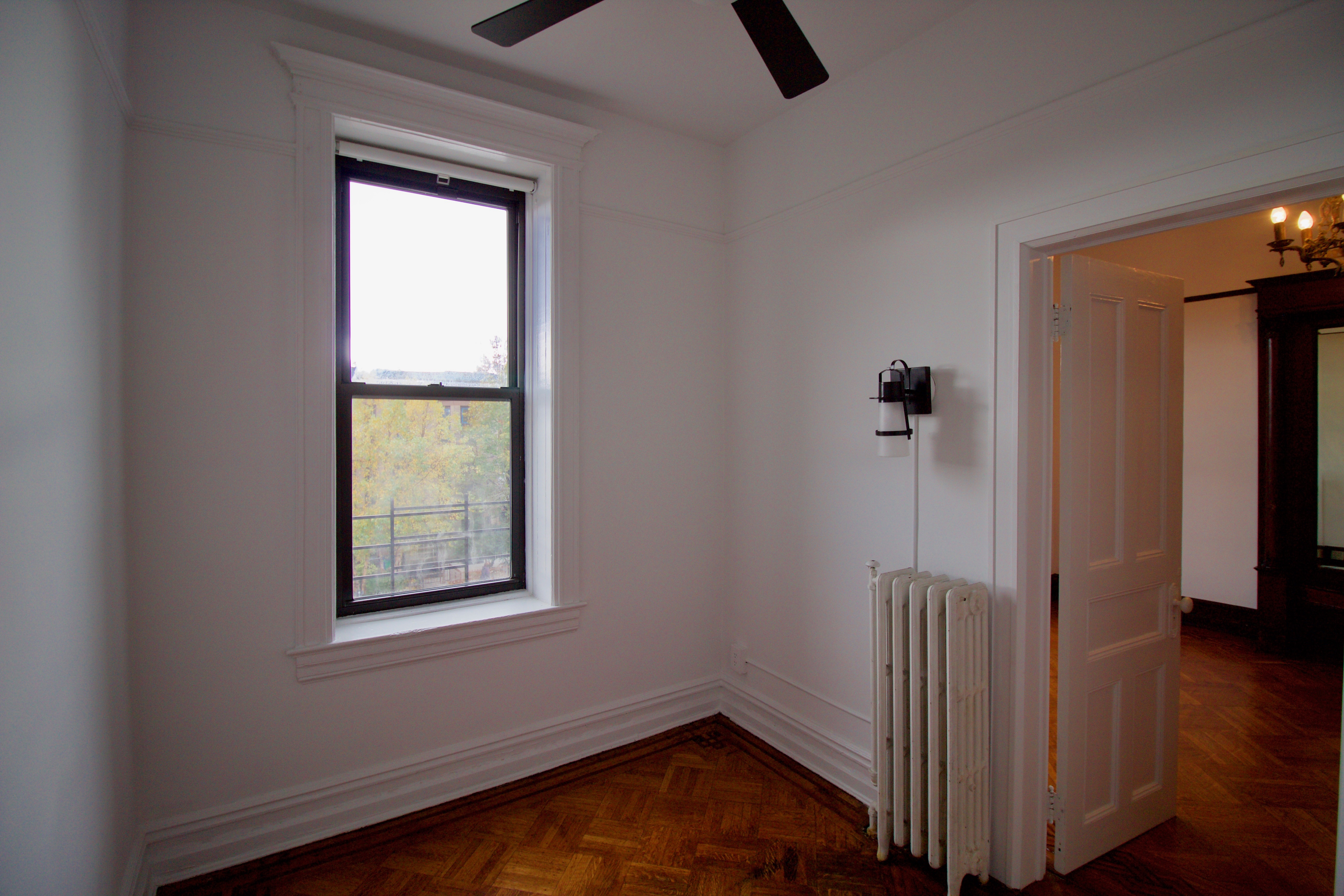 403 Caton Avenue, Unit 3 Brooklyn, NY 11218 - Photo 25 of 31 a view of an entryway with wooden floor and door