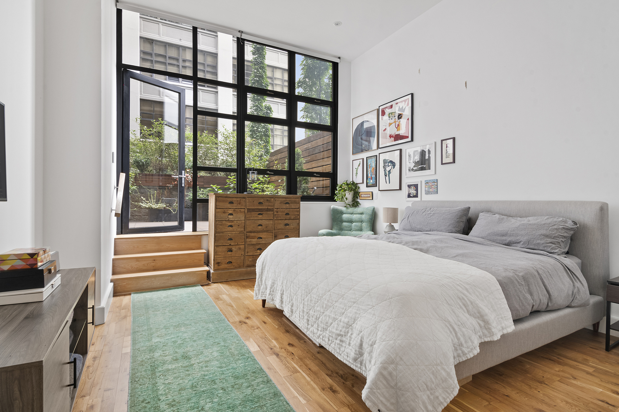 360 Furman Street, Unit 320/321 Brooklyn, NY 11201 - Photo 10 of 28 a spacious bedroom with a bed and a window