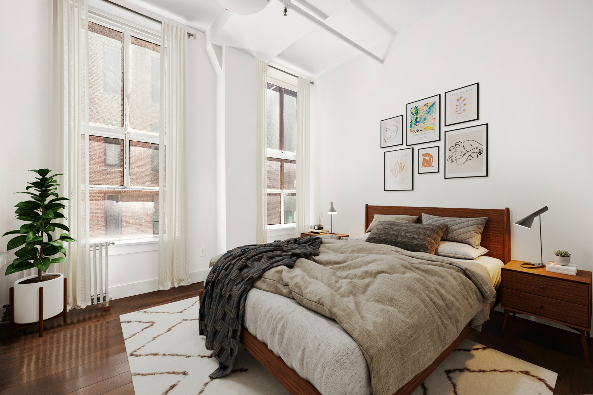 12 West 17th Street, Unit 9 Manhattan, NY 10011 - Photo 6 of 9 a bedroom with a bed and a potted plant