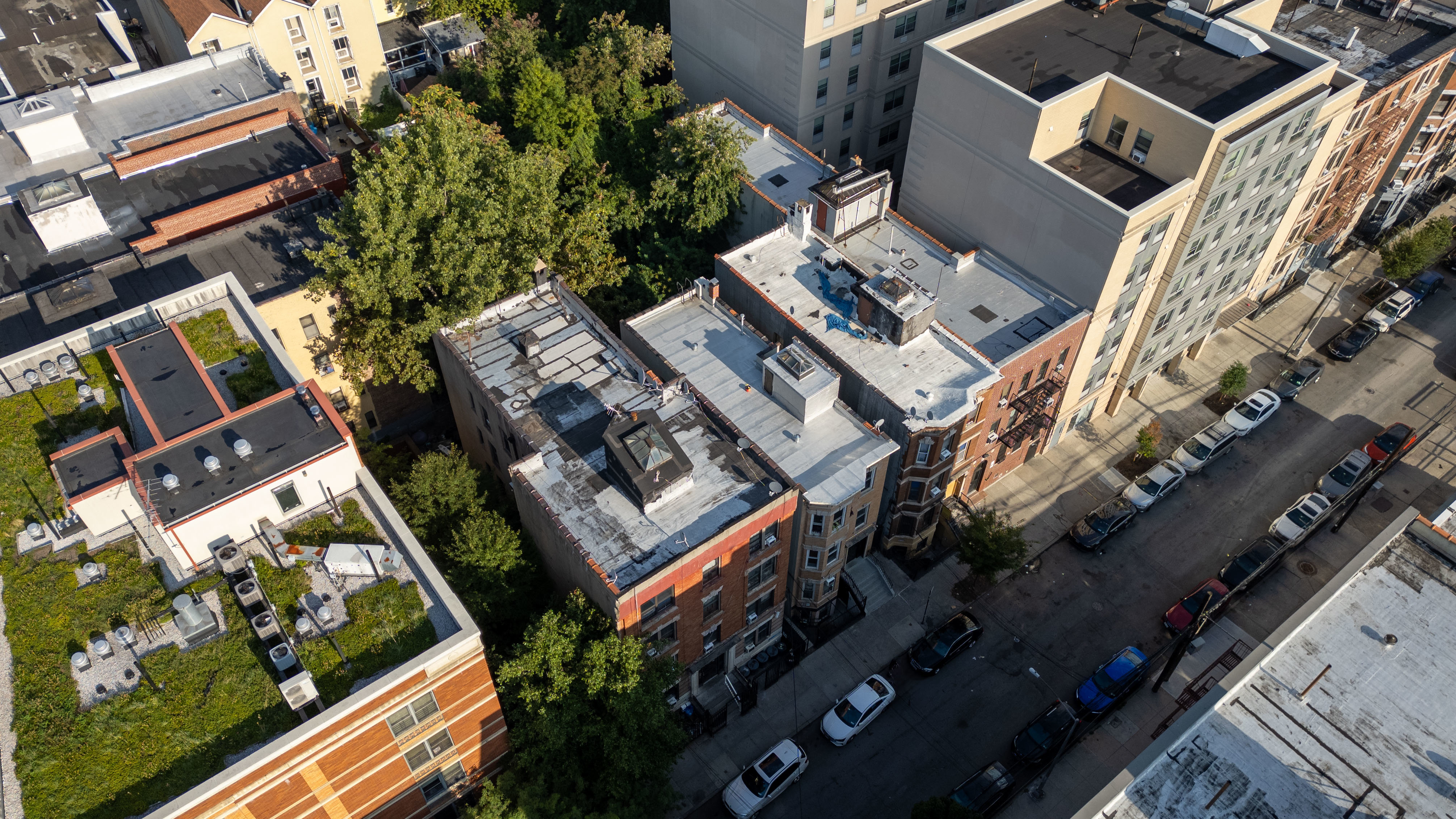 2023 Hughes Avenue Bronx, NY 10457 - Photo 32 of 63 an aerial view of a residential apartment building with a yard