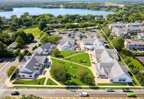 a view of a white house with a outdoor space