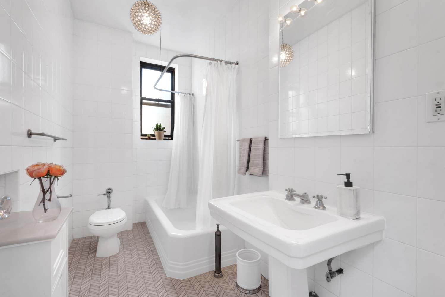 215 West 98th Street, Unit 8F Manhattan, NY 10025 - Photo 8 of 16 a bathroom with a toilet sink and mirror
