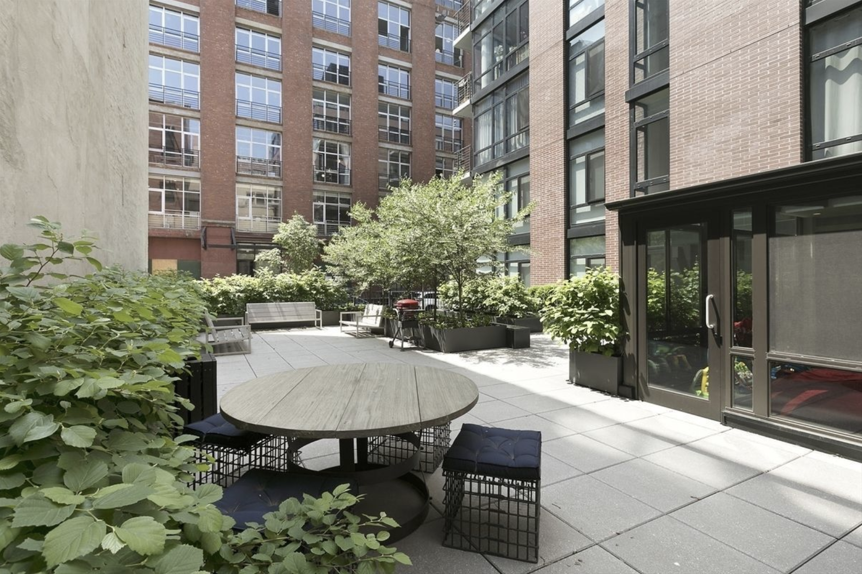 47 Bridge Street, Unit 5D Brooklyn, NY 11201 - Photo 15 of 21 a view of a patio with table and chairs and potted plants