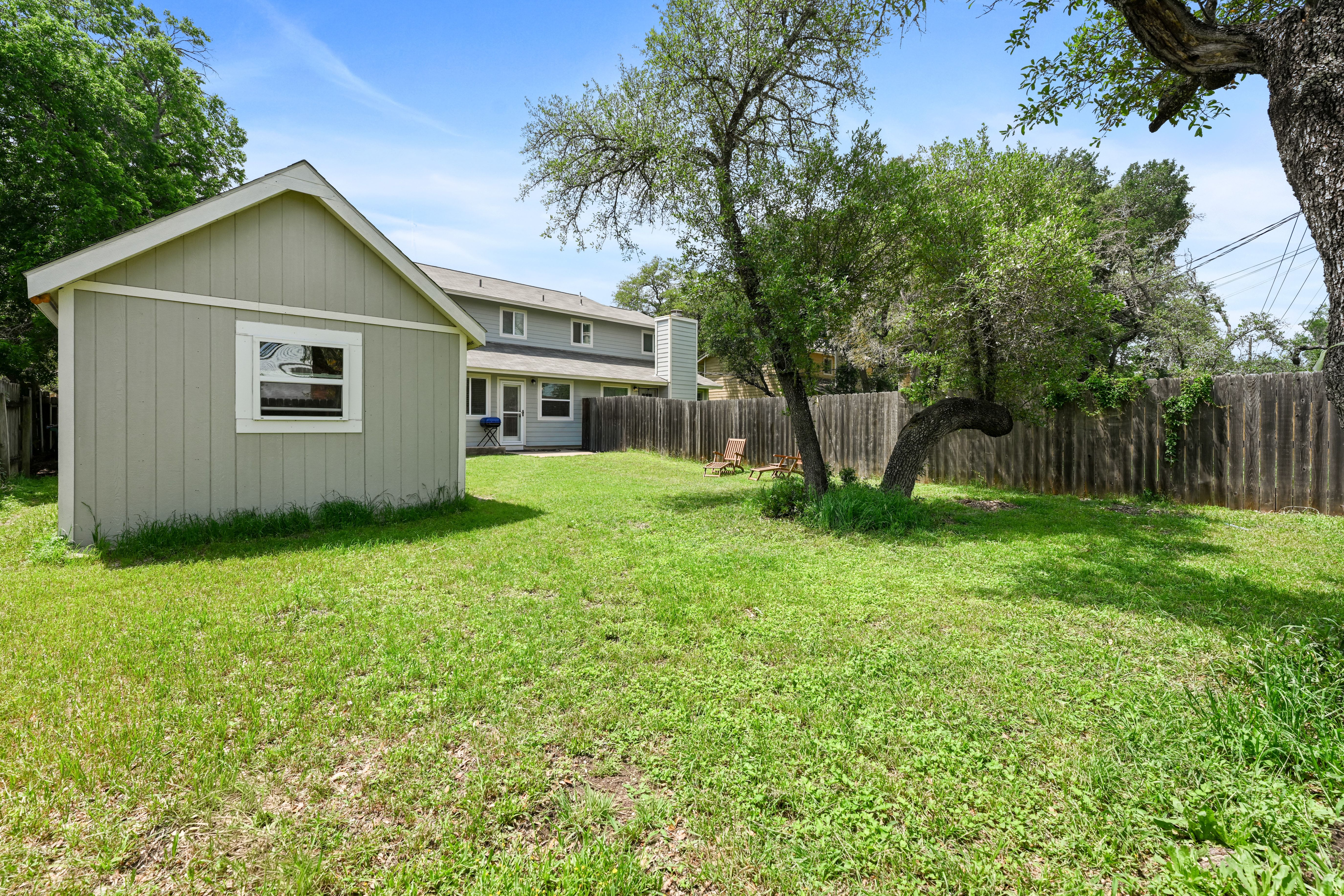 8710 Clearbrook Trail Austin, TX 78729 - Photo 14 of 28 a view of backyard of house with green space