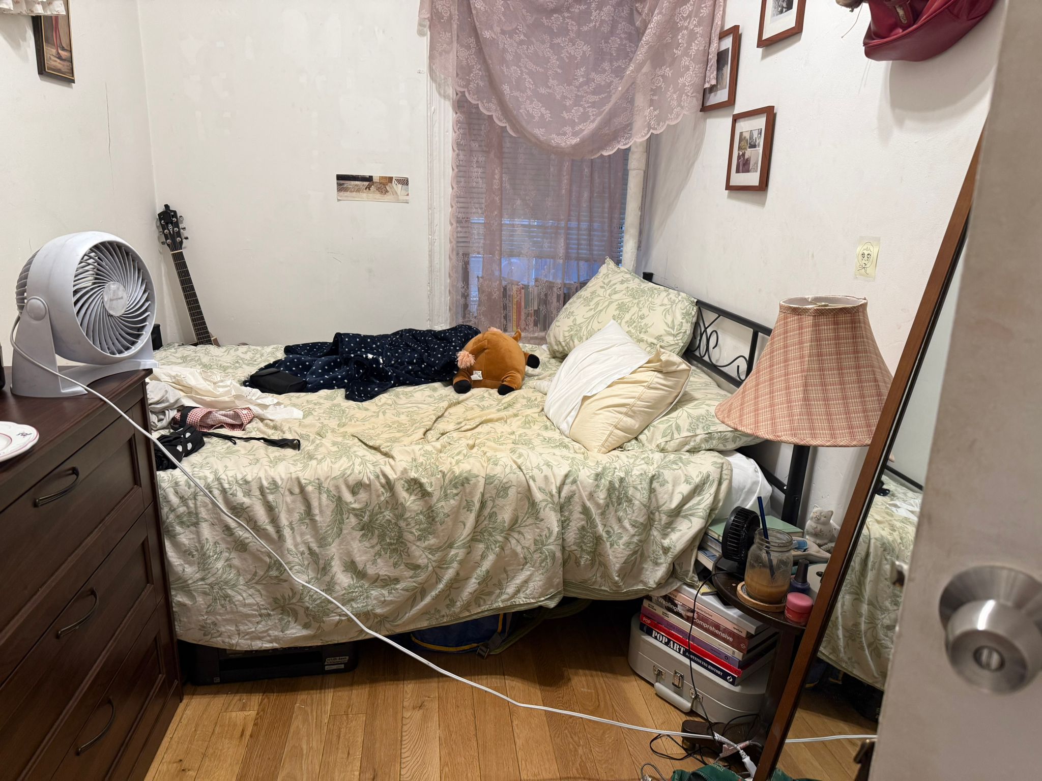 1278 1st Avenue, Unit 2 Manhattan, NY 10065 - Photo 13 of 19 a bed sitting in a bedroom next to a window