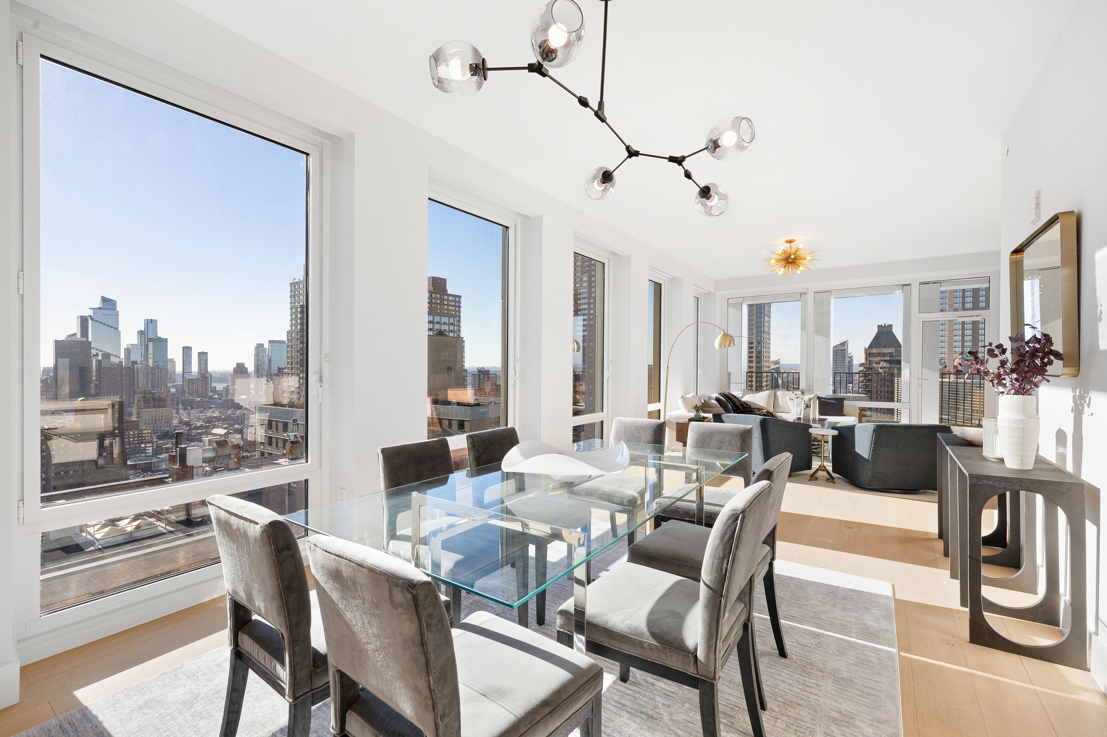 15 West 61st Street, Unit PH1C Manhattan, NY 10023 - Photo 6 of 26 a view of a dining room with furniture window and outside view