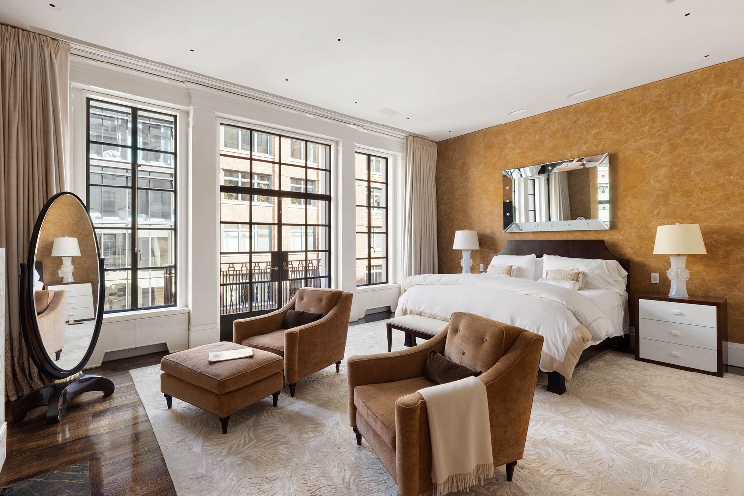 a living room with a couch and a potted plant