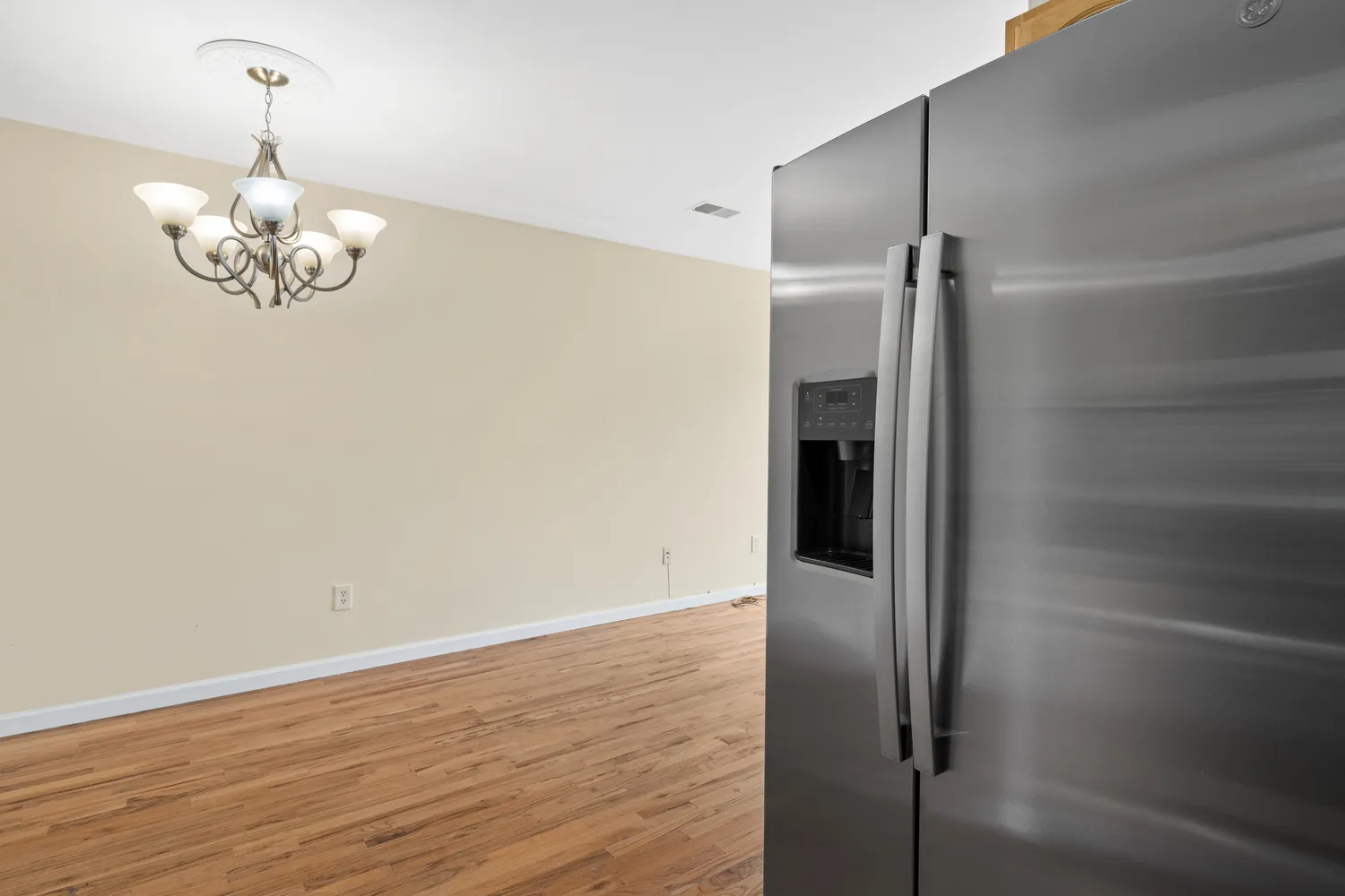 a kitchen with stainless steel appliances granite countertop a stove and cabinets