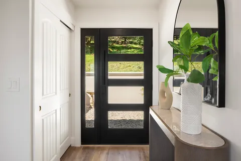 a view of living room with furniture and a window