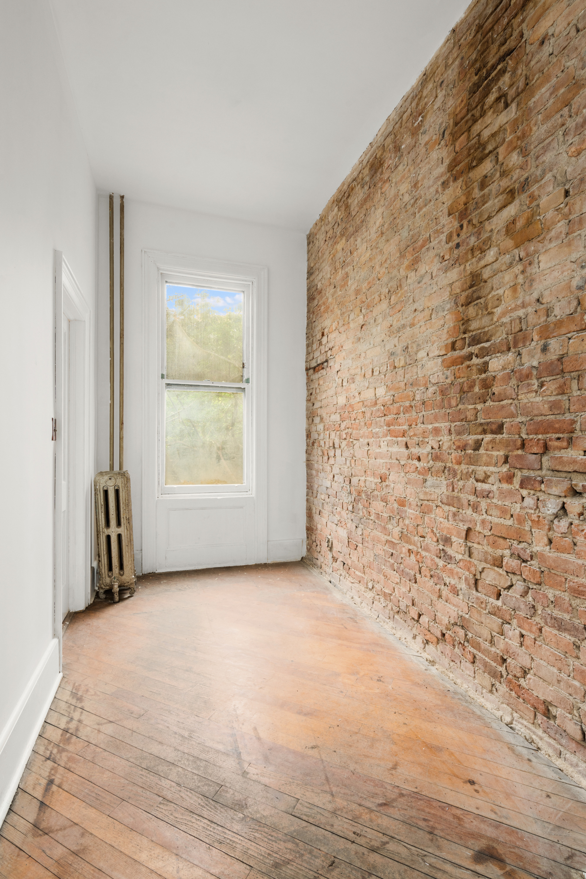 217 Dean Street Brooklyn, NY 11217 - Photo 7 of 26 a view of an empty room with a window