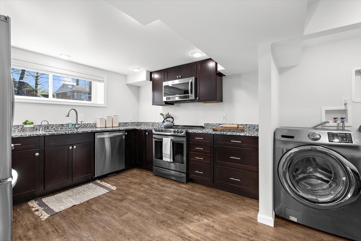 12712 Atherton Drive Silver Spring, MD 20906 - Photo 23 of 40 a kitchen with a sink and a stove top oven